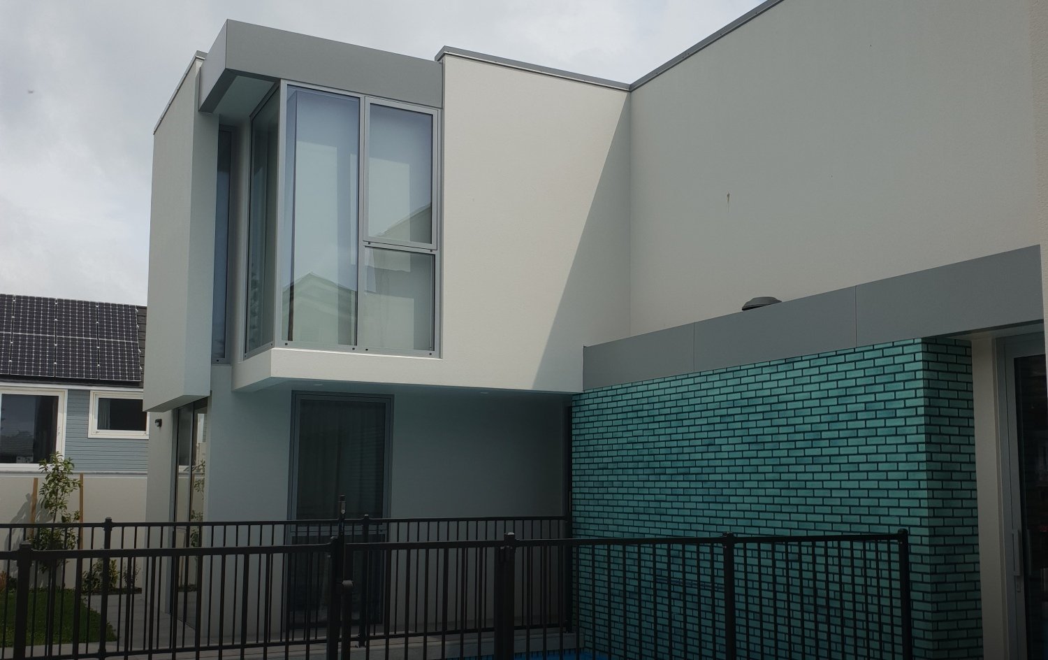Plaster clad modern home with pool